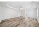 Spacious main bedroom with wood-look flooring and tray ceiling at 200 Haleys Ct, Woodstock, GA 30188