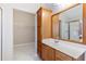 Bathroom with wood vanity and walk-in closet at 307 Jessica Way, Canton, GA 30114