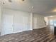 Spacious living room with LVP flooring and ceiling fan at 1535 Iris Walk, Jonesboro, GA 30238