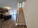 Elegant staircase with wrought iron railing leading to the second floor at 1535 Iris Walk, Jonesboro, GA 30238