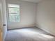Bright bedroom with carpeted floors and large window at 1535 Iris Walk, Jonesboro, GA 30238