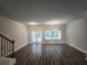 Spacious living room with hardwood floors and lots of natural light at 1535 Iris Walk, Jonesboro, GA 30238