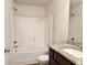 Clean bathroom featuring a bathtub, granite countertop, and vanity at 1535 Iris Walk, Jonesboro, GA 30238
