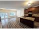 Modern kitchen with granite island and dark cabinets at 1535 Iris Walk, Jonesboro, GA 30238