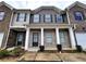 Two-story townhome with brick and siding at 1535 Iris Walk, Jonesboro, GA 30238