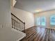 Bright living room with hardwood floors and access to backyard at 1535 Iris Walk, Jonesboro, GA 30238