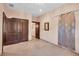 Simple bedroom with double doors and neutral color palette at 3920 Westbrook Rd, Suwanee, GA 30024