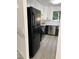 Modern kitchen featuring black and white cabinets, stainless steel appliances and farmhouse sink at 2688 Landington Way, Duluth, GA 30096