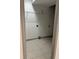 Laundry room with tile flooring and wire shelving at 2688 Landington Way, Duluth, GA 30096
