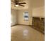 Living room with tile flooring, fireplace, and ceiling fan at 2688 Landington Way, Duluth, GA 30096