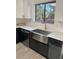 Modern kitchen with stainless steel farmhouse sink and white quartz countertops at 2688 Landington Way, Duluth, GA 30096