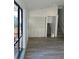 Living room with large window and built-in shelving at 2688 Landington Way, Duluth, GA 30096