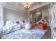 Gathering room with coffered ceiling, comfortable seating, and hardwood floors at 3960 Carissa Trce, Cumming, GA 30040