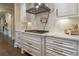 Modern kitchen with white cabinets, marble backsplash, and gas cooktop at 3960 Carissa Trce, Cumming, GA 30040