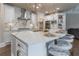 White kitchen with marble countertops and a statement island at 3960 Carissa Trce, Cumming, GA 30040