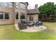 Outdoor patio with firepit and seating area at 3960 Carissa Trce, Cumming, GA 30040