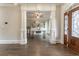 Bright entryway with hardwood floors, built-in shelving, and French doors at 3960 Carissa Trce, Cumming, GA 30040