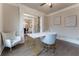 Home office with hardwood floors, built-in shelving, and comfortable seating at 3960 Carissa Trce, Cumming, GA 30040