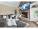 Spacious Gathering room featuring a stone fireplace, built-in shelving, and ample seating at 3960 Carissa Trce, Cumming, GA 30040