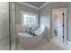 Stunning bathroom featuring a free-standing tub, marble tile, and stained glass window at 3960 Carissa Trce, Cumming, GA 30040