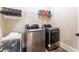Convenient laundry room with washer, dryer, and utility sink at 3960 Carissa Trce, Cumming, GA 30040