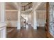 Two-story foyer with hardwood floors and white columns at 3960 Carissa Trce, Cumming, GA 30040