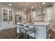Open concept kitchen with white cabinets and a large island at 3960 Carissa Trce, Cumming, GA 30040