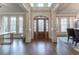 Bright and spacious entryway with hardwood floors and large windows at 3960 Carissa Trce, Cumming, GA 30040