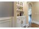 Built-in wet bar with wine rack, cabinetry, and quartz countertop at 3960 Carissa Trce, Cumming, GA 30040