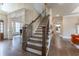 Elegant staircase with ornate railing leading to upper level at 3960 Carissa Trce, Cumming, GA 30040