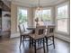 Kitchen breakfast nook with table and chairs, surrounded by windows at 3960 Carissa Trce, Cumming, GA 30040