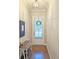 Bright entryway with wood floors and bench at 2128 Sonoma Se Dr, Smyrna, GA 30080