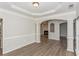 Bright dining room with hardwood floors and view of fireplace at 2342 Timberwolf Ct, Buford, GA 30519