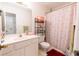 Bathroom features a shower/tub, toilet and vanity at 2915 Camelot Woods Dr, Lawrenceville, GA 30044