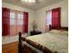 Bedroom with hardwood floors, a double bed, and red curtains at 2194 Klondike Sw Rd, Conyers, GA 30094