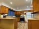 Galley kitchen with stainless steel appliances and wood cabinets at 2194 Klondike Sw Rd, Conyers, GA 30094
