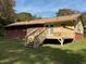 Brick ranch house with wooden deck and backyard at 2194 Klondike Sw Rd, Conyers, GA 30094