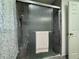 Walk-in shower with glass doors and marble-like walls at 2194 Klondike Sw Rd, Conyers, GA 30094