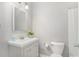 Simple bathroom with vanity, toilet, and mirror at 400 Bass Sw St, Atlanta, GA 30310