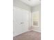Bright bedroom with double closets and neutral-toned carpet at 400 Bass Sw St, Atlanta, GA 30310
