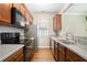 Kitchen with stainless steel appliances and wood cabinets at 400 Bass Sw St, Atlanta, GA 30310