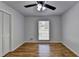 Bedroom with hardwood floors, window, and built-in closet at 1365 Renee Dr, Decatur, GA 30035