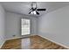 Well-lit bedroom featuring hardwood floors and a window at 1365 Renee Dr, Decatur, GA 30035