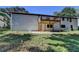 Back of house with deck and patio, surrounded by grass at 1365 Renee Dr, Decatur, GA 30035