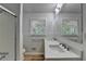 Updated bathroom with double vanity and a shower at 1365 Renee Dr, Decatur, GA 30035
