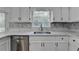Modern kitchen with white cabinets and quartz countertops at 1365 Renee Dr, Decatur, GA 30035