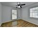 Well-lit bedroom with hardwood floors and two windows at 1365 Renee Dr, Decatur, GA 30035