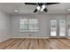 Bright dining room with hardwood floors and access to deck at 1365 Renee Dr, Decatur, GA 30035