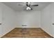 Simple bedroom with hardwood floors and ceiling fan at 1365 Renee Dr, Decatur, GA 30035