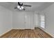 Well-lit bedroom with hardwood floors and a ceiling fan at 1365 Renee Dr, Decatur, GA 30035